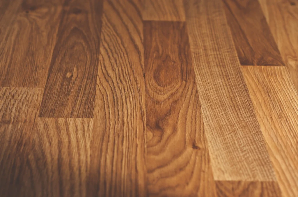 Close-up of laminate flooring surface with realistic wood grain
