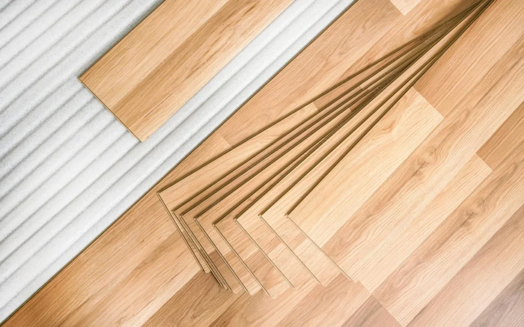 SPC flooring sample planks showing rigid core structure and realistic wood grain design